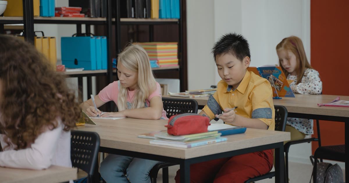 Children in a classroom reading and learning together